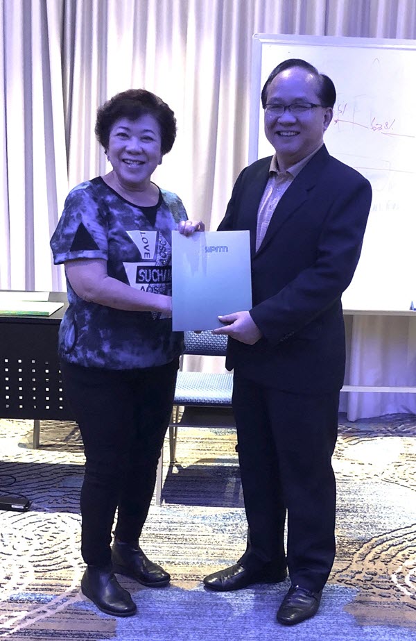 Ms Rhena Tan (Purchasing Consultant) receiving her certificate